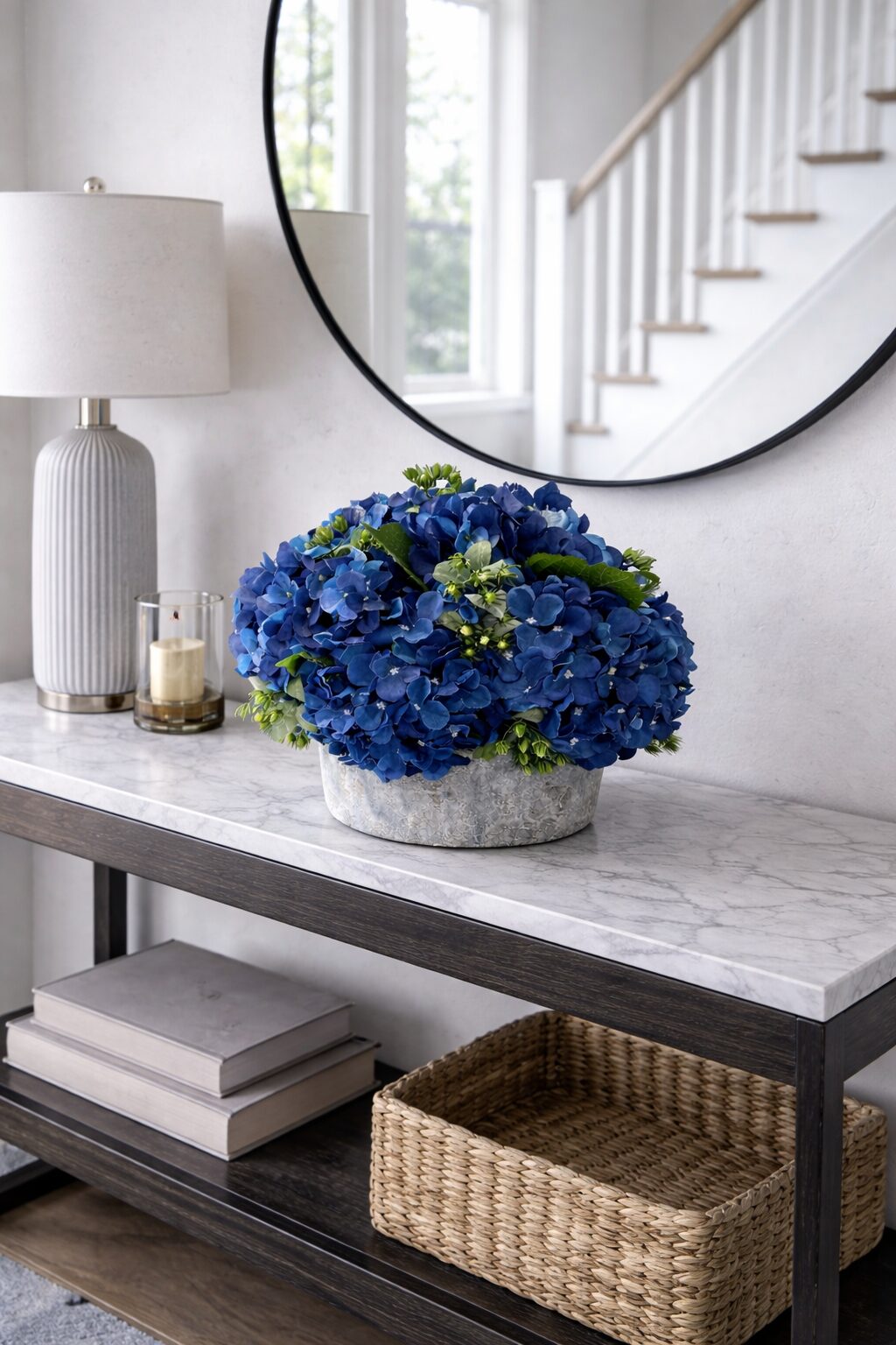Bright blue faux hydrangea arrangement in a weathered pot