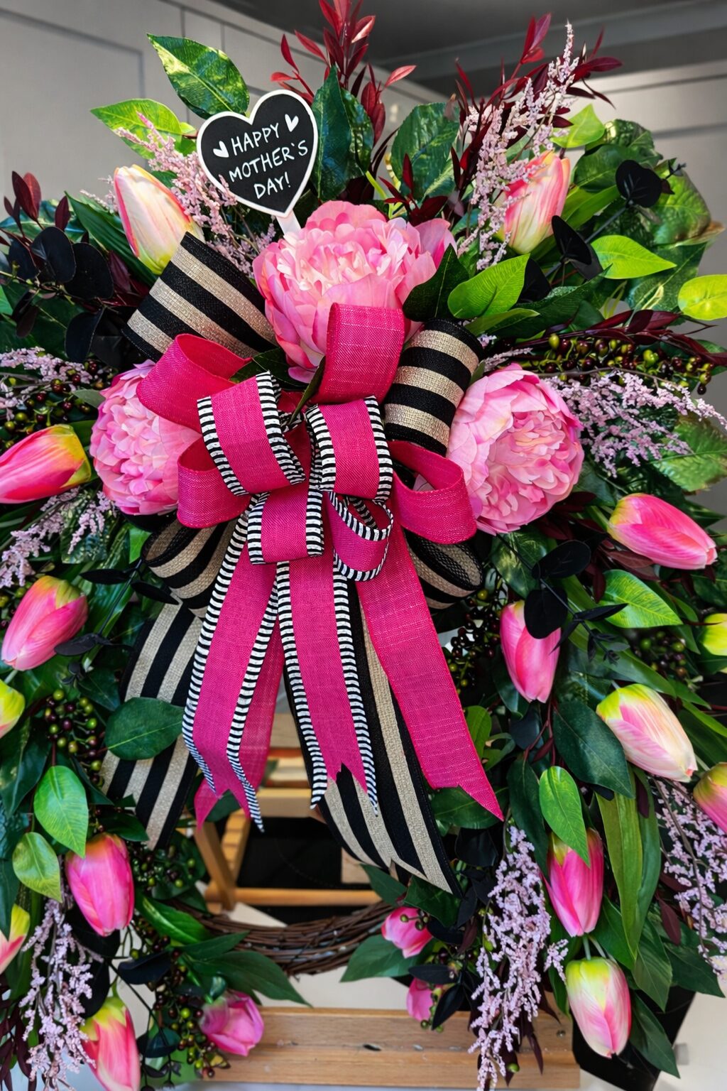 Mother's Day faux wreath with pink peonies, tulips and striped ribbon
