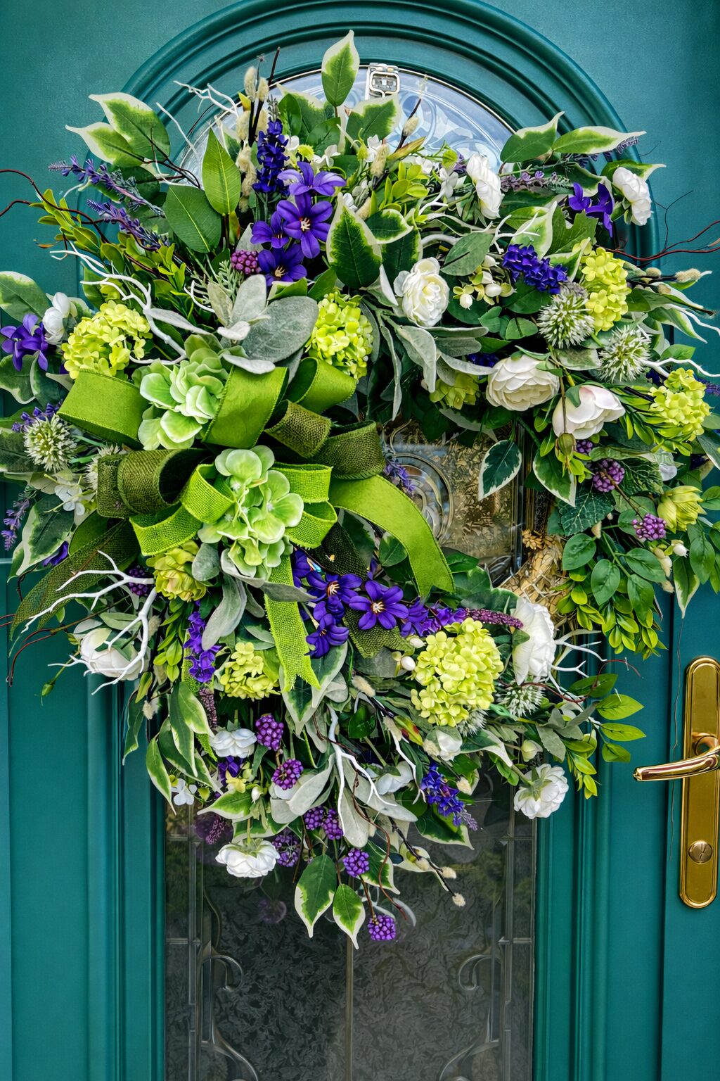 Green and violet spring faux wreath with lime hydrangeas and white ranunculus